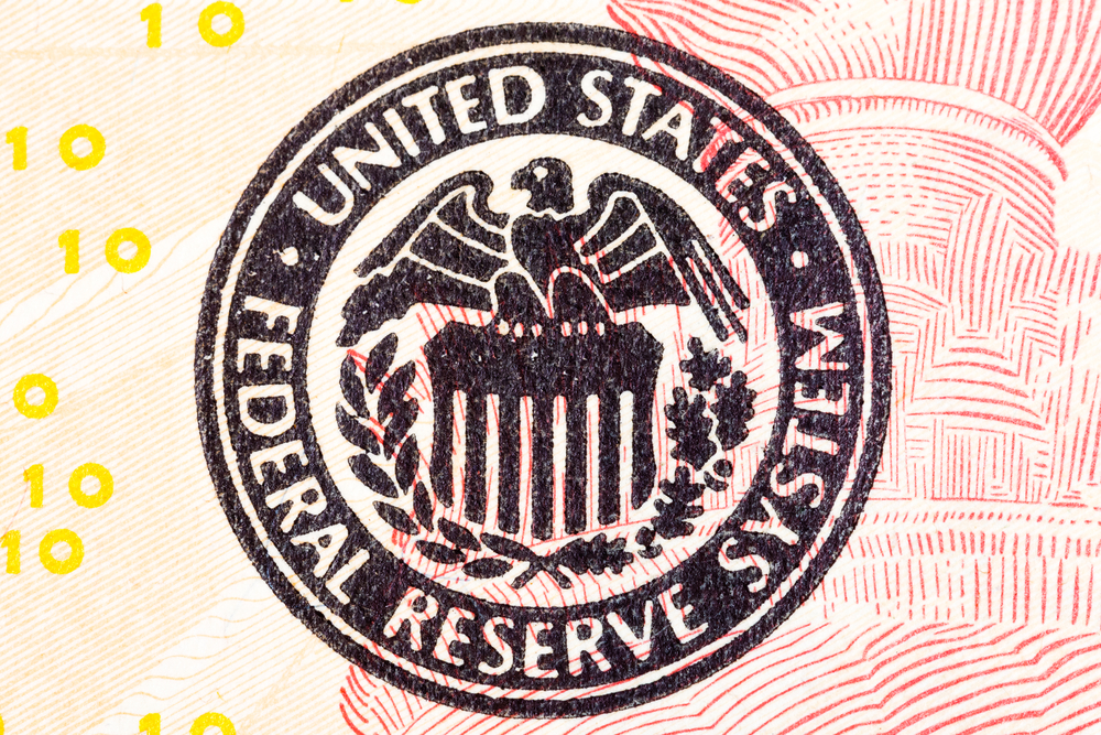 Federal Reserve icon on a dollar bill; the discount rate indicates a direction for monetary policy
