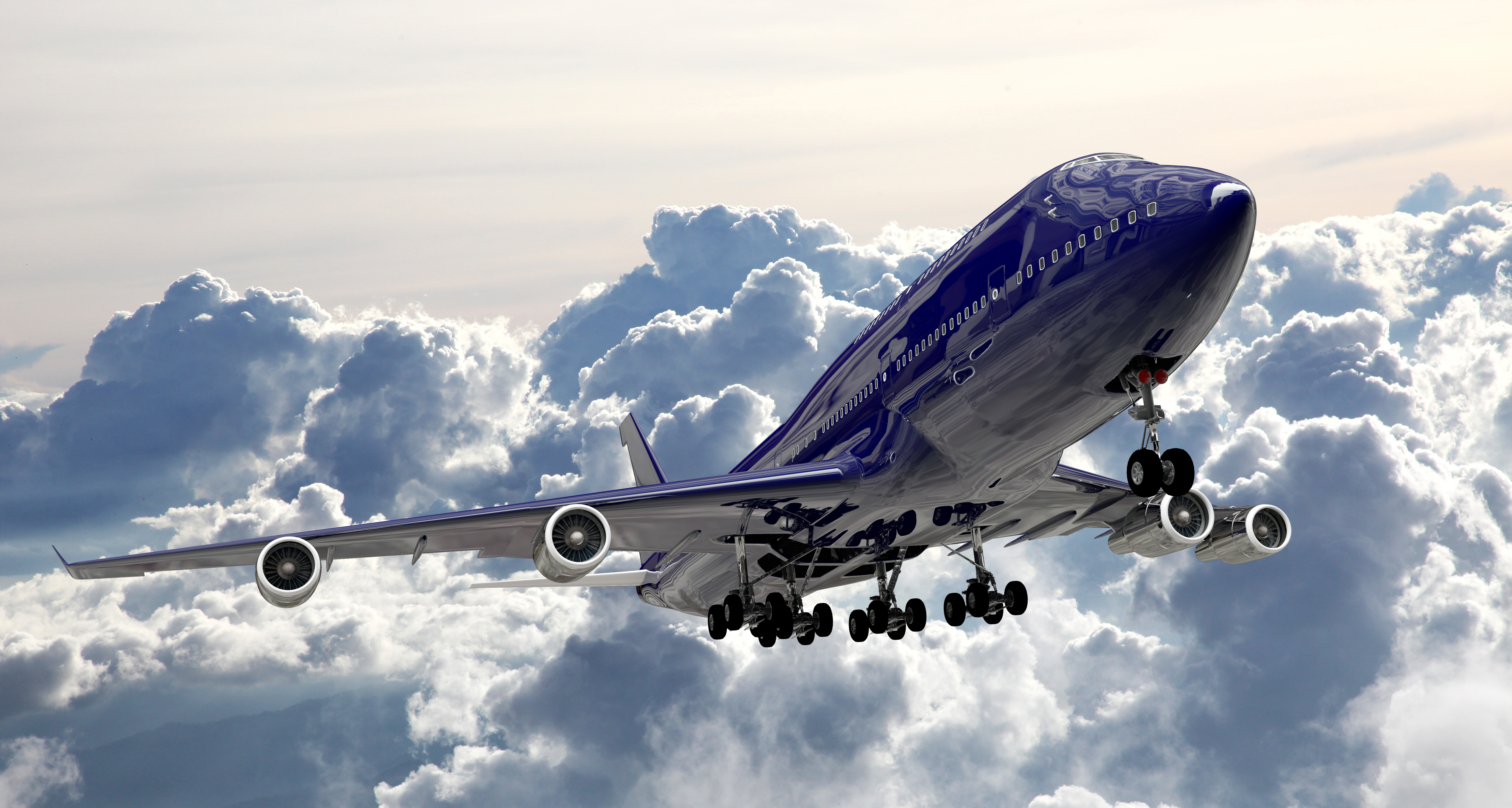 boeing jet breaking through the clouds after takeoff