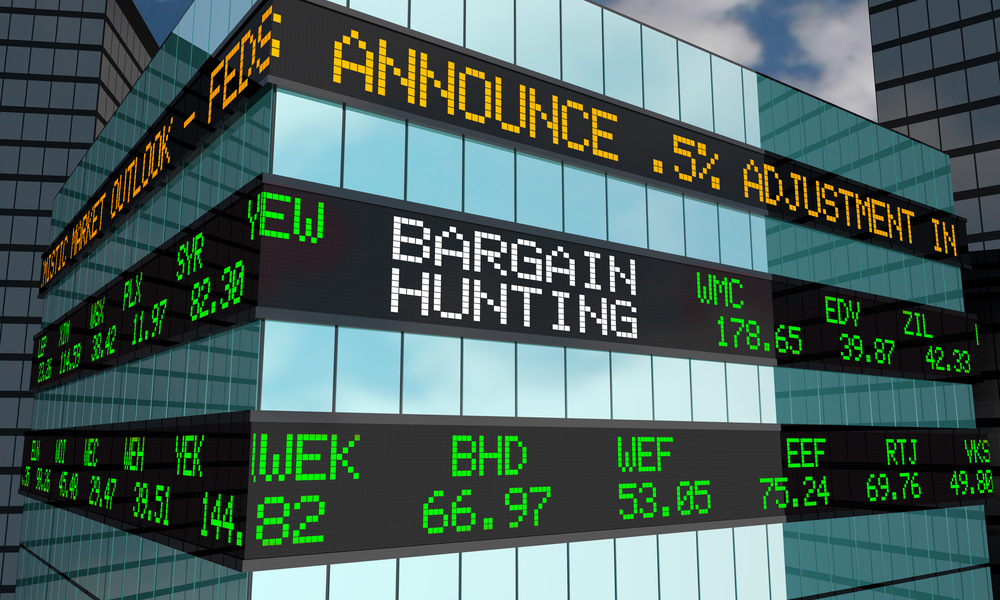 Photo of a stock ticker showing Bargain Hunting and stock prices. Keep reading to learn what a value trap is and how to avoid them.