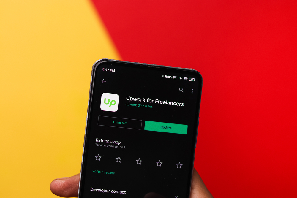 UpWork Freelancer app logo on phone screen close-up top view