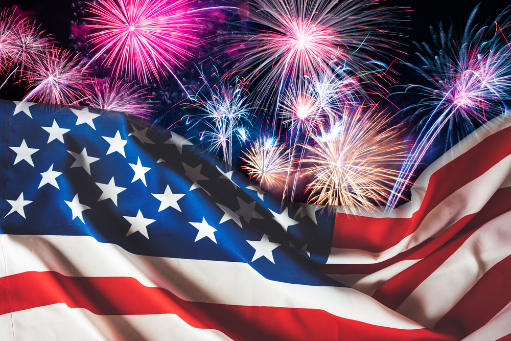 American flag and fireworks with night sky background. 