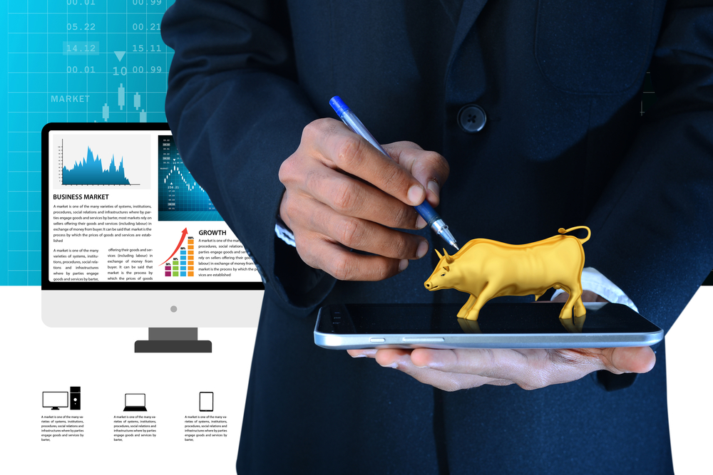 Businessman and golden bull 