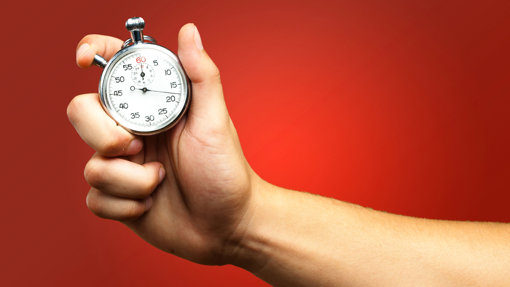 Photo of a person holding a countdown timer. Short-term stocks to consider investing in.