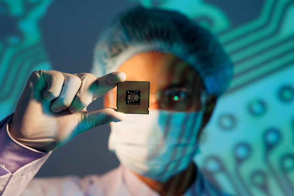 scientist holding semiconductor chip 