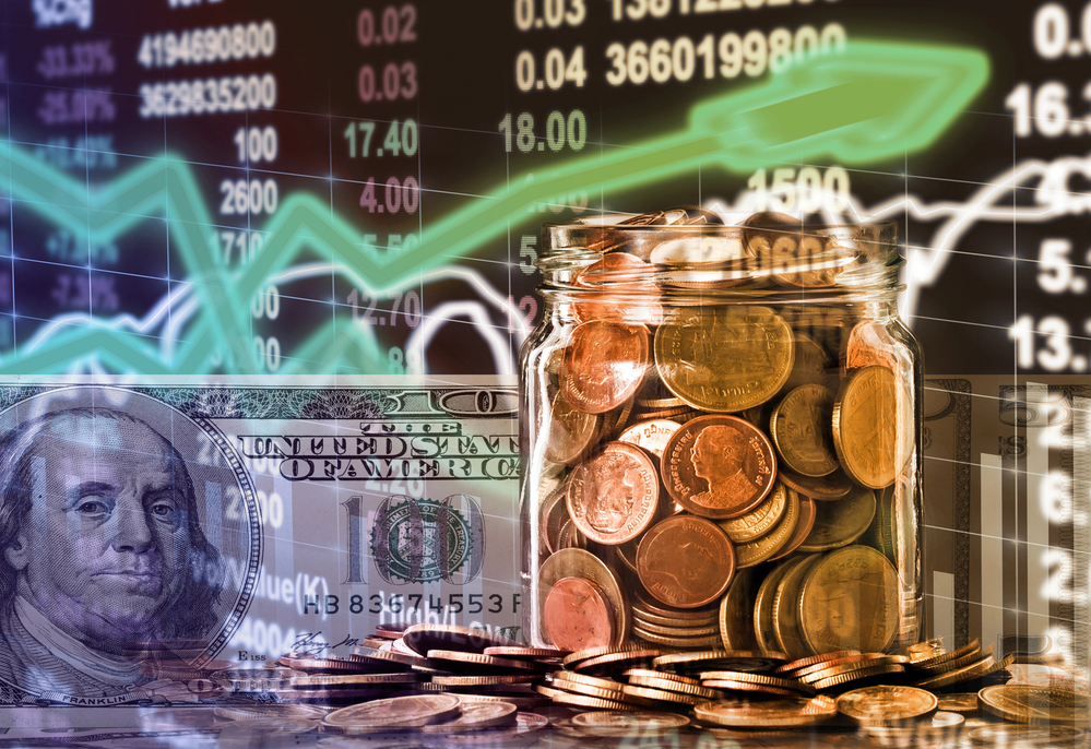 stock chart dollar bills coins in jar