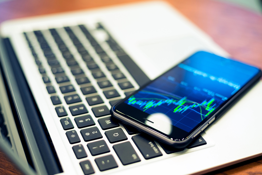 Smartphone with stock market graph on a screen