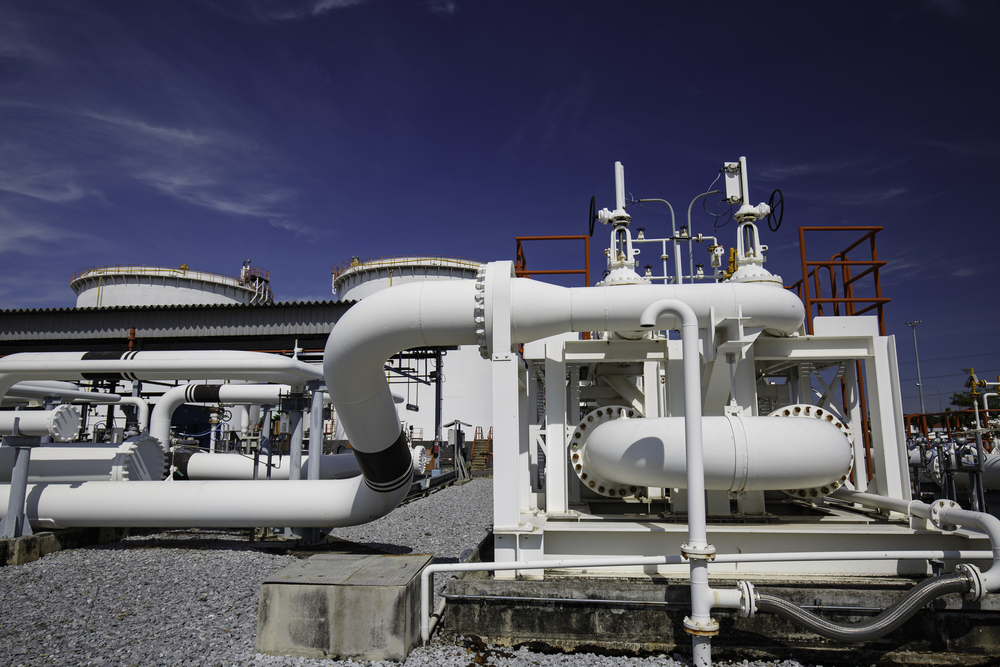 Steel long pipes and pipe elbow in station oil factory during refinery Petrochemistry industry in gas site distillery.