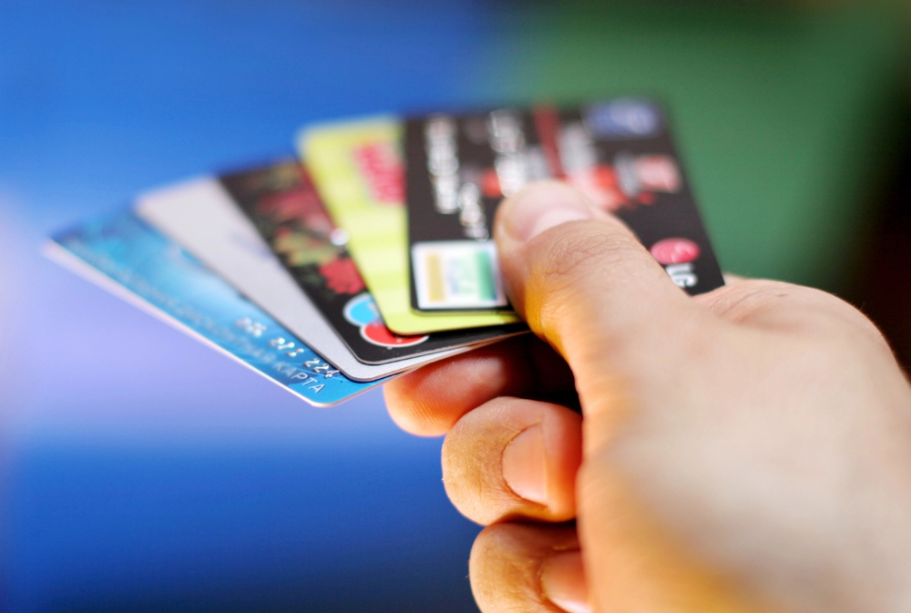 hand holding credit cards