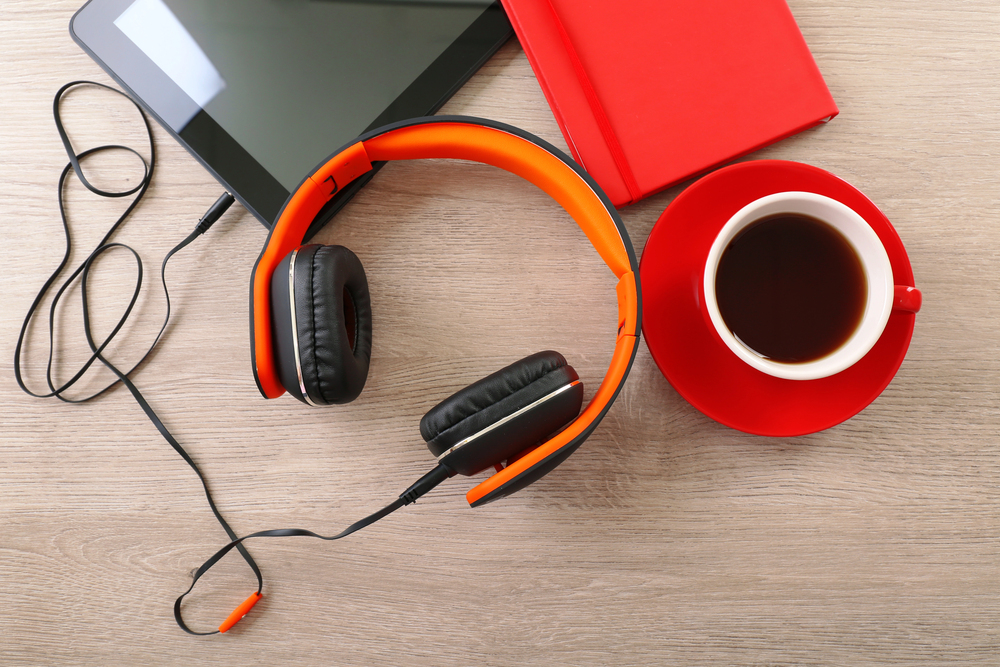 Headphones with tablet and cup of coffee — Photo