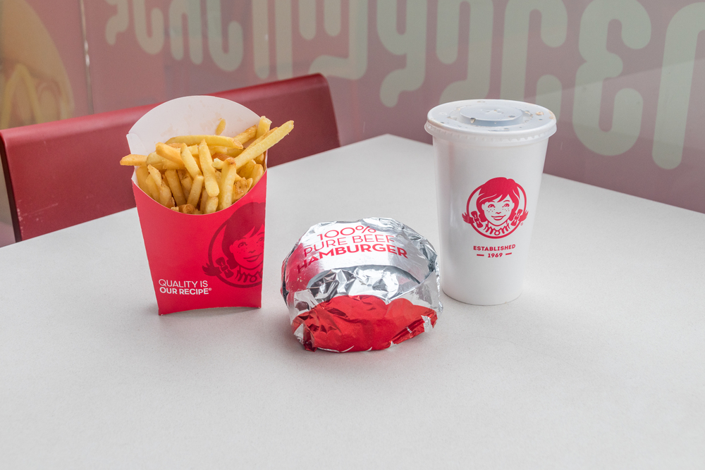 Wendy's meal with french fries, burger and cup with drink.