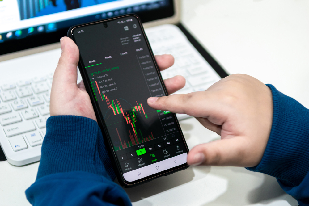 Child business analyze financial graphs stock market concept with technology