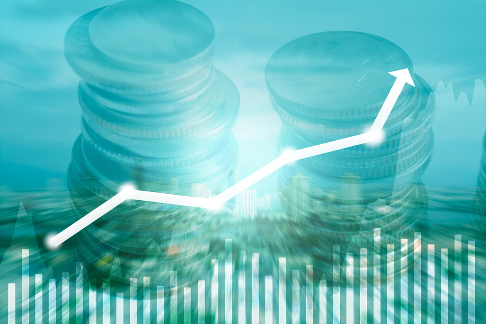 business growth concept, close up coins with grapth growth arrow up