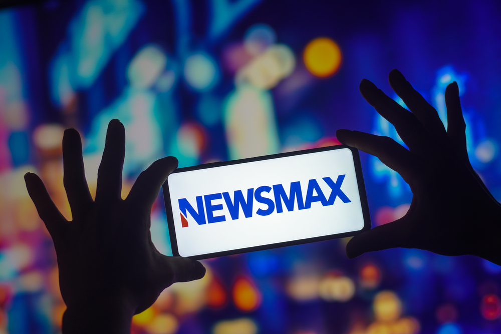 September 26, 2022, Brazil. In this photo illustration, the Newsmax logo seen displayed on a smartphone
