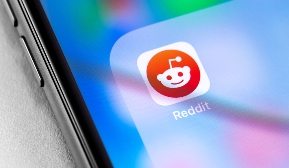 closeup smartphone with Reddit icon app on the screen. Reddit - social news site. Moscow, Russia - June 28, 2019