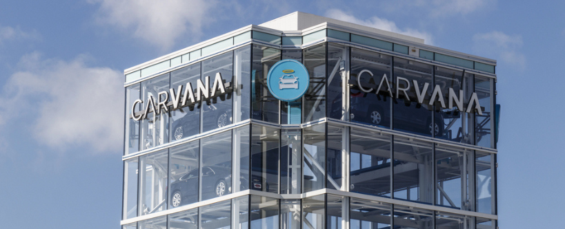 Photo of a Carvana building with cars inside.