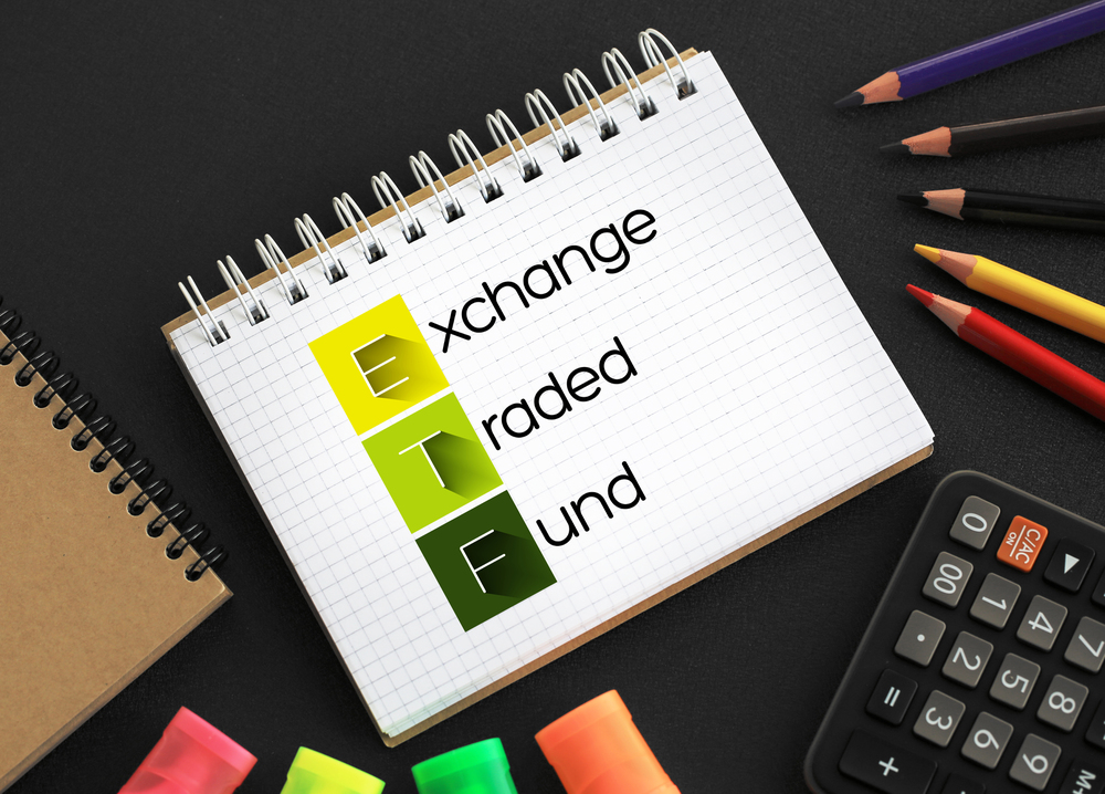 ETF - Exchange Traded Fund acronym on notepad, business concept background