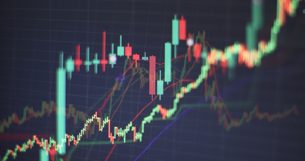 Technical price graph and indicator, red and green candlestick chart on blue theme screen, market volatility, up and down trend. Stock trading, crypto currency background.