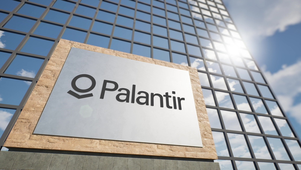 Photo of Palatir signboard with logo next to the modern skyscraper, 3D