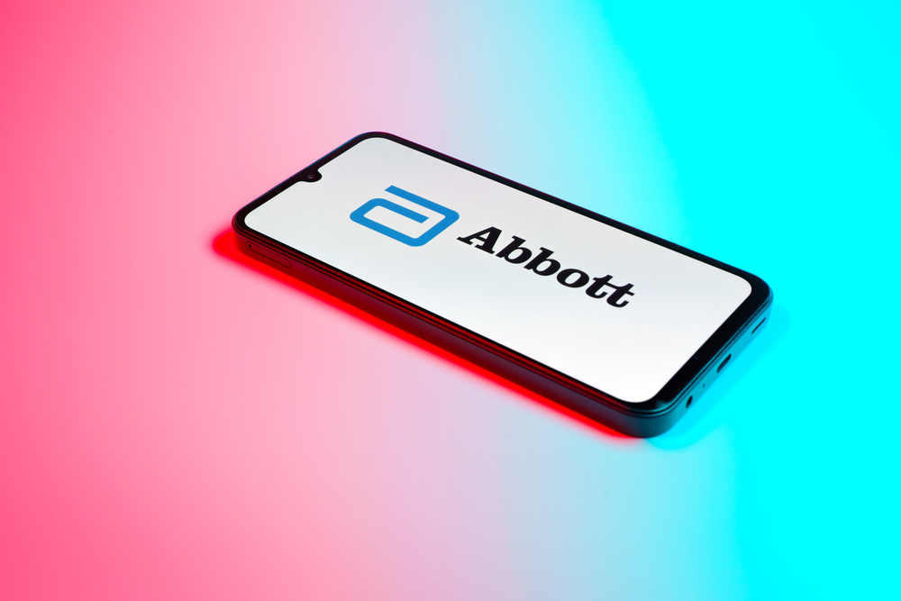 Prague, Czechia - October 21, 2024: Modern smartphone device on surface background showing abbott logo. — Stock Editorial Photography