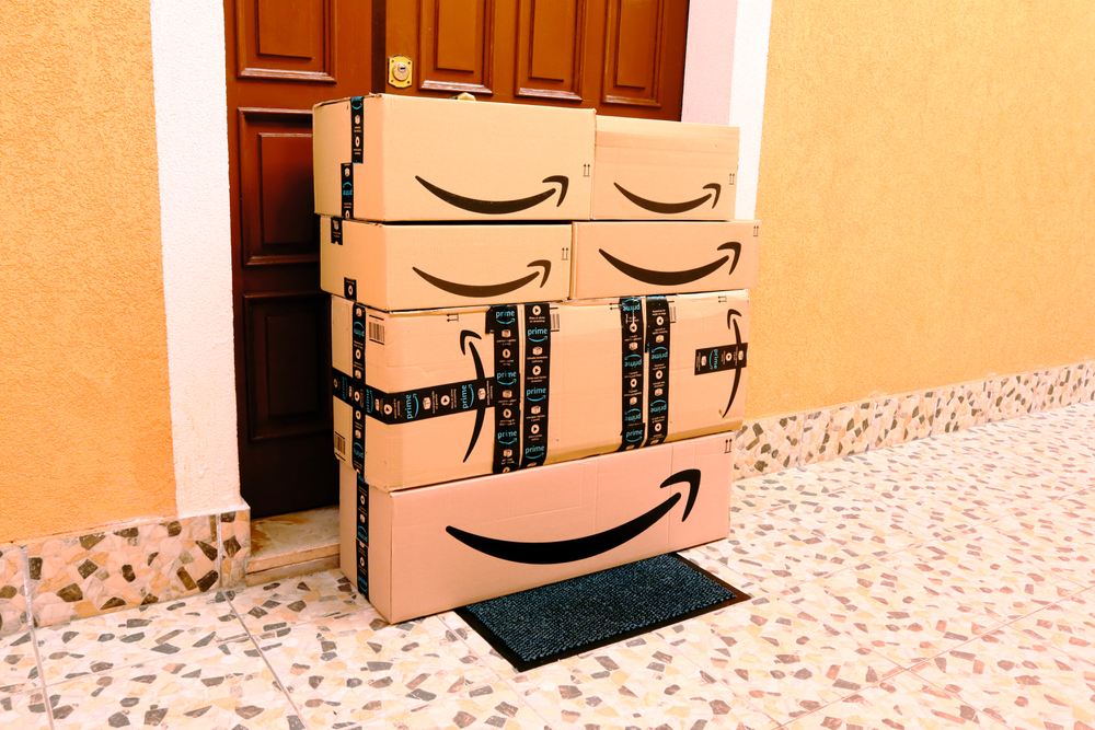 Amazon packages, boxes delivery to the door - Stock Editorial Photography