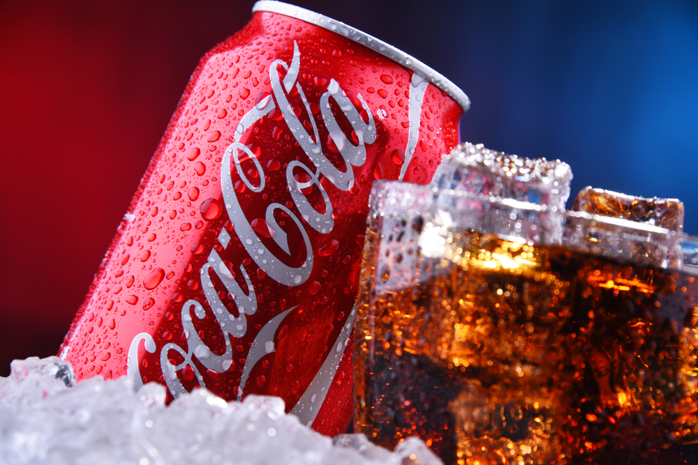 A glass and a can of Coca-Cola - Stock Editorial Photography
