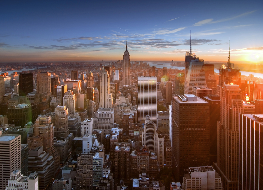 Photo of Sunset over manhattan, large buildings symbolizing large-cap
