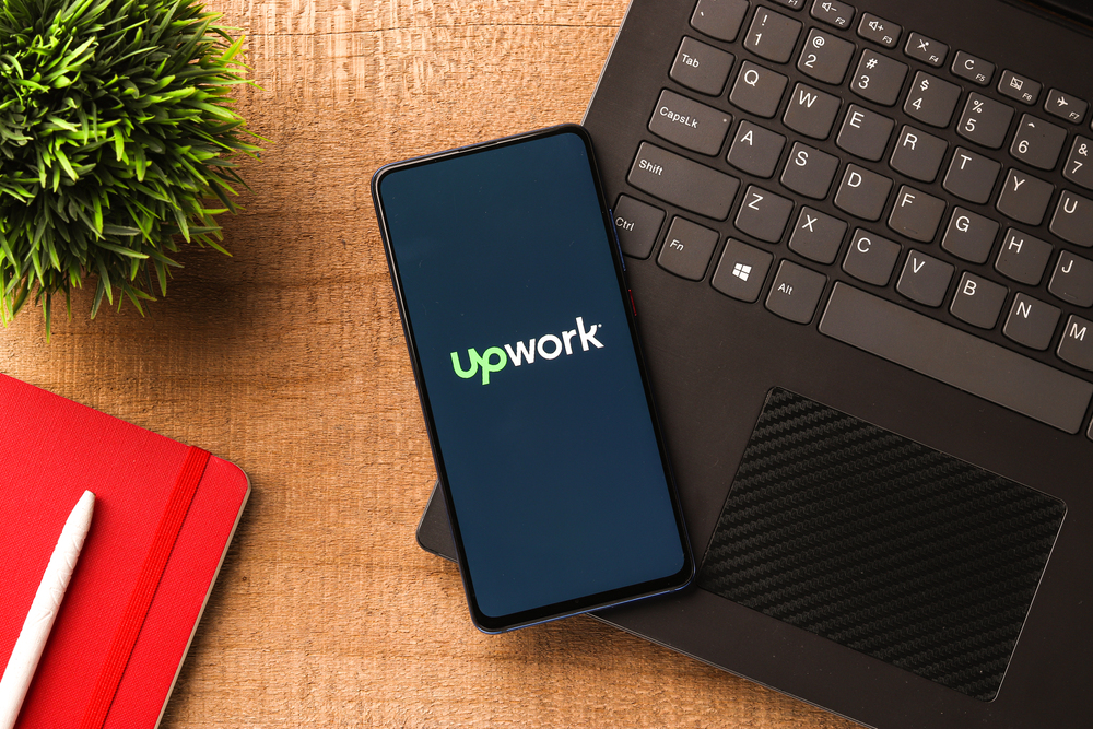 Assam, india - November 29, 2020 : Up work logo on phone screen stock image. - Stock Editorial Photography
