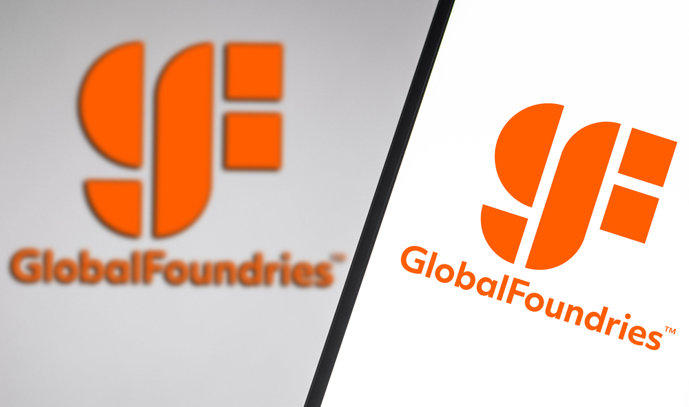December 14, 2021, Brazil. In this photo illustration the GlobalFoundries logo seen displayed on a smartphone and on the background