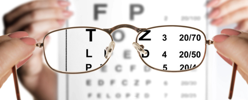 Photo of ophthalmologist checking eyesight, glasses, eye chart