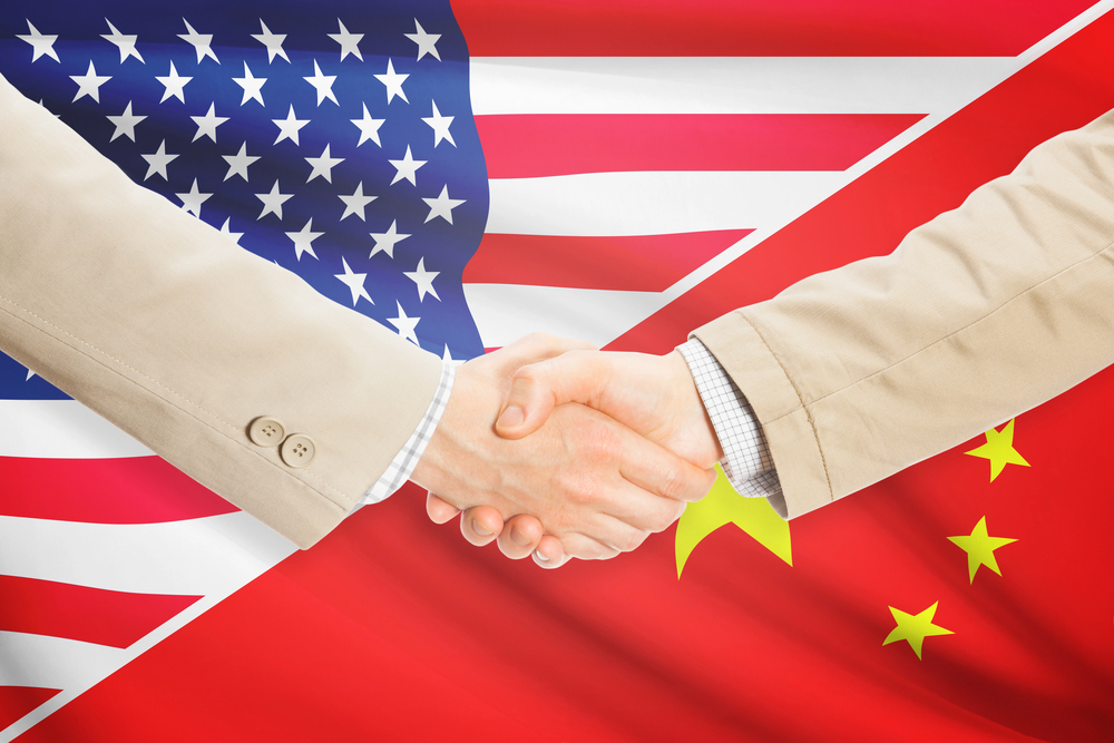 Businessmen handshake - United States and China - stock image