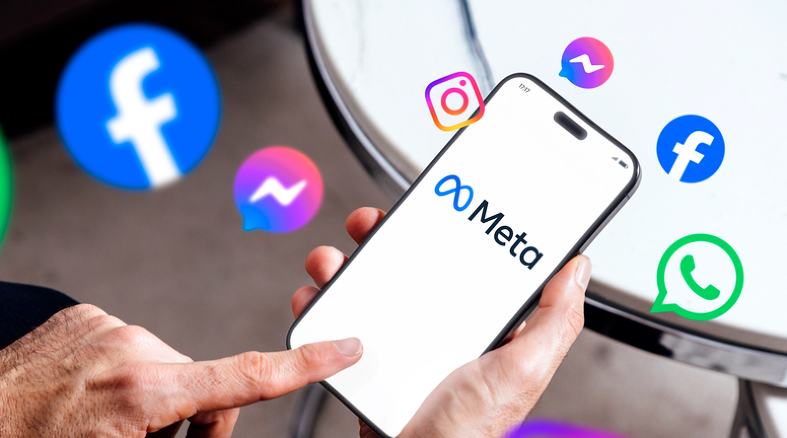 Meta on mobile phone screen. Man holding smartphone showing Meta logotype and other brands like Facebook and Instagram. Ads concept. Rosario, Argentina - January 20, 2025. — Stock Editorial Photography