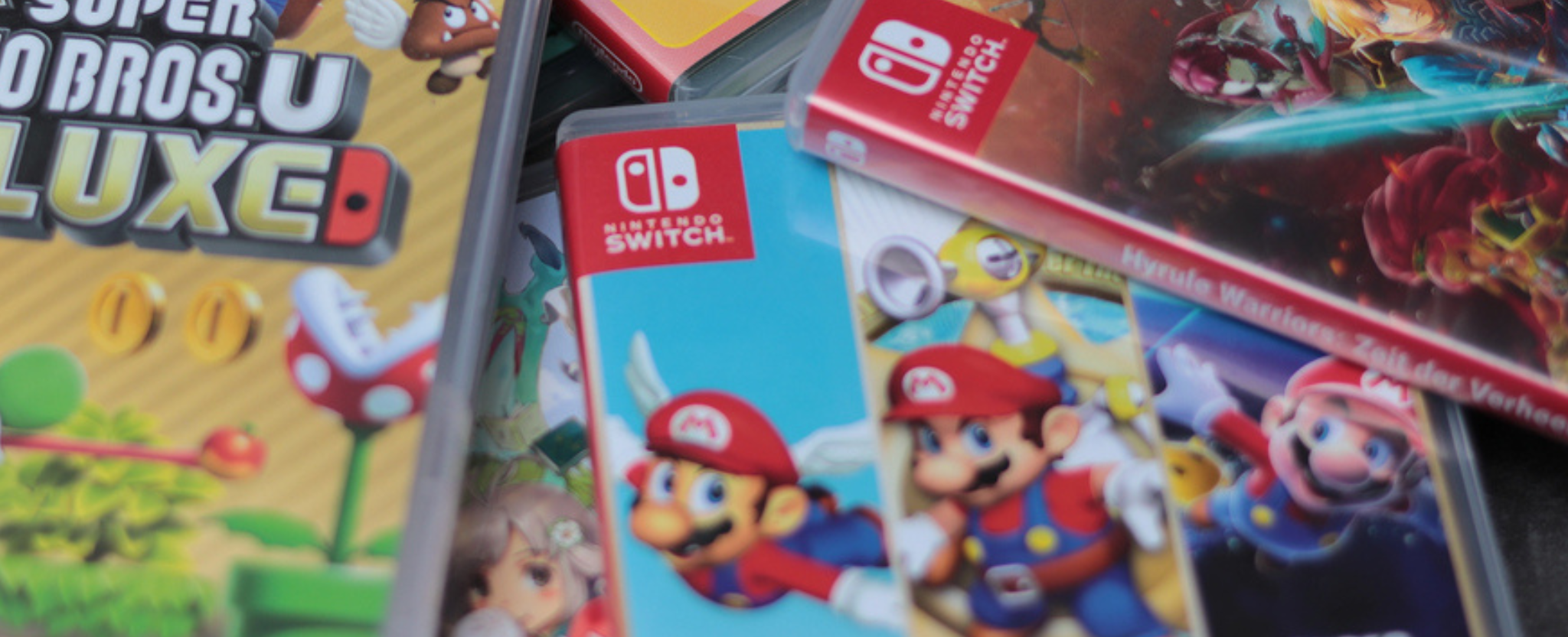 BERLIN, GERMANY - May 28, 2021: Close up of various games for Nintendo Switch, concept — Photo by Wirestock