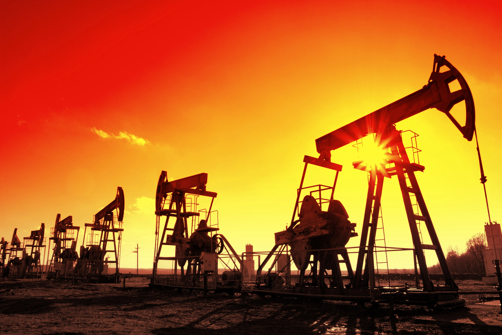 Working oil pumps silhouette in row — Photo