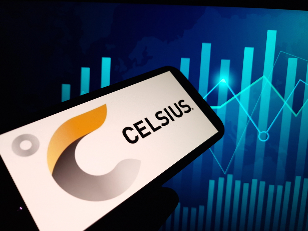Photo of Celsius logo on a smart phone with a stock chart in the background