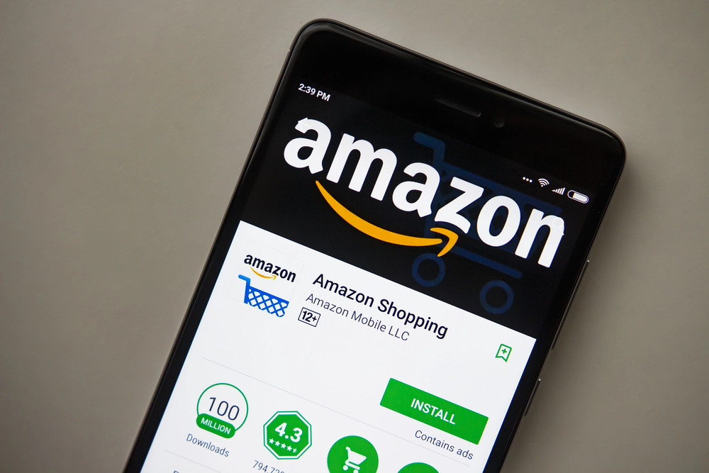 Berlin, Germany - November 19, 2017: Amazon application on screen of modern smartphone close-up. Install menu of Amazon app in Play Store. Shopping apps on display of phone. — Photo