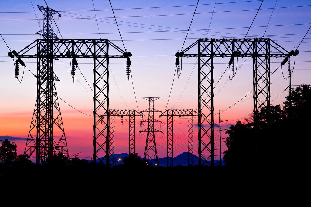 Electric pole, High voltage post and sky in twilight time - stock image