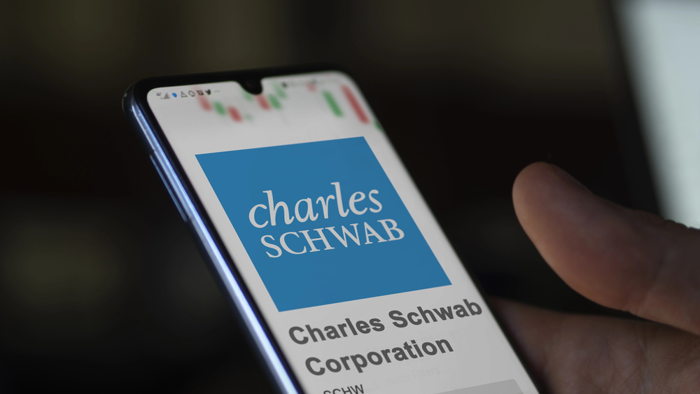 April 09th 2024 , Westlake, Texas. Close up on logo of Charles Schwab Corporation on the screen of an exchange. Charles Schwab Corporation price stocks, $SCHW on a device. — Stock Editorial Photography
