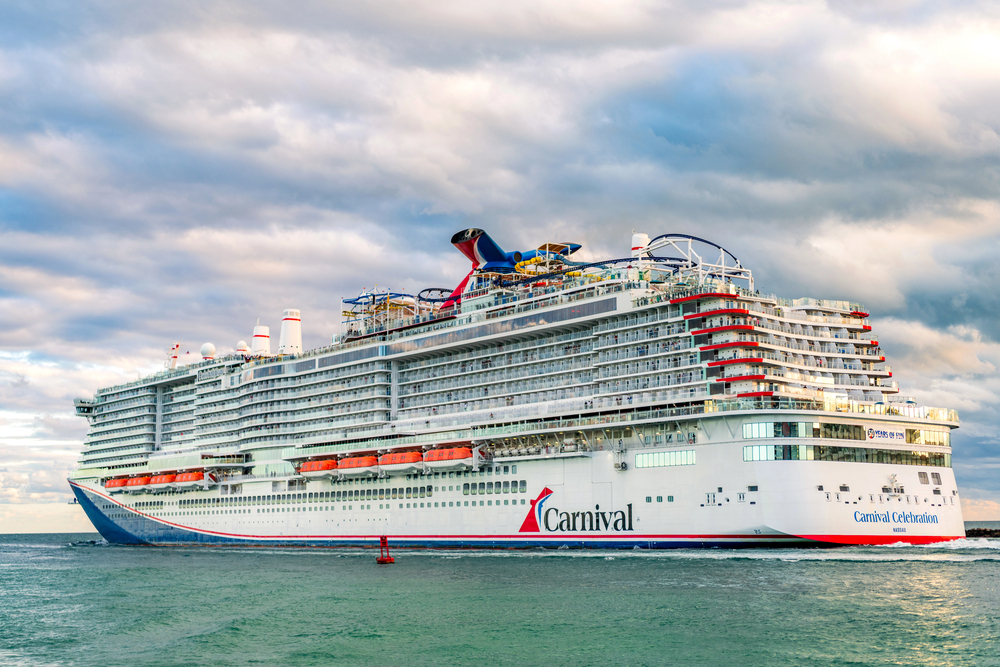 Miami, Florida, USA - December 23, 2024: Cruise resort in summer vacation. Carnival cruise line. Cruise ship tour and travel at sea. Ship leaving Miami port. Carnival Celebration cruise ship voyage. — Stock Editorial Photography