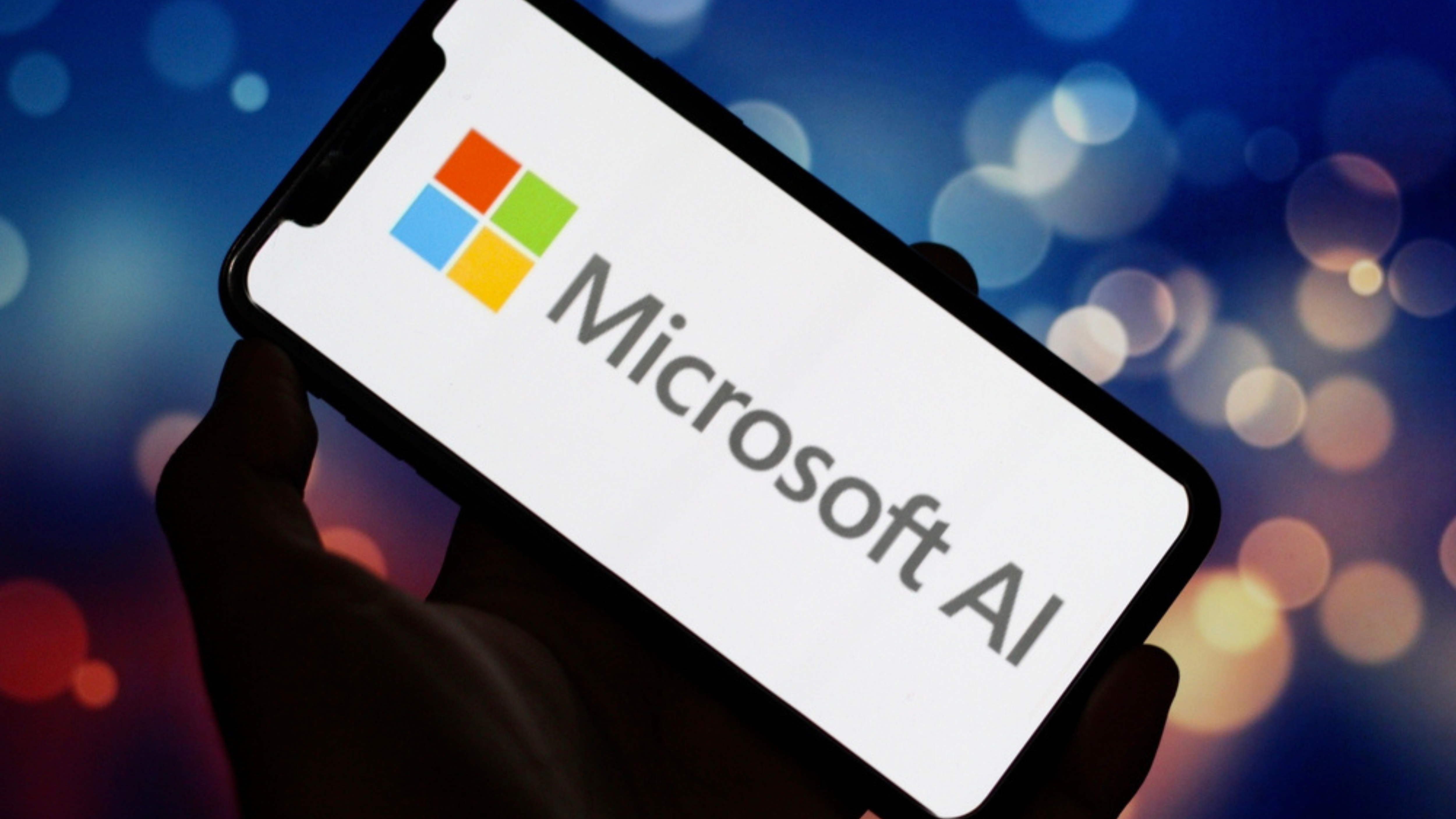 Microsoft AI logo on smarphone with blurred background