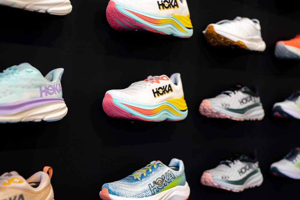 SOUTHLAKE, TX, USA-JUN 12, 2024: Front view collection of latest HOKA running shoes on display at upscale sport store, lightweight training, road racing, track spikes cushion own by Deckers Brands — Stock Editorial Photography