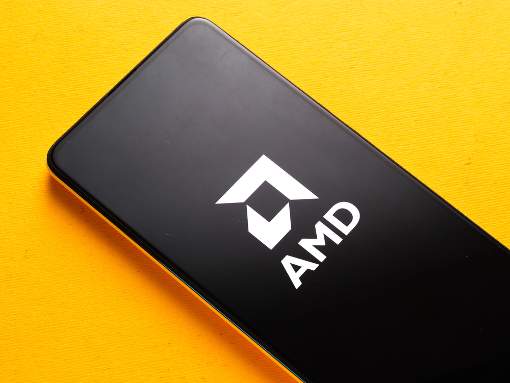 AMD logo on smartphone screen with yellow background