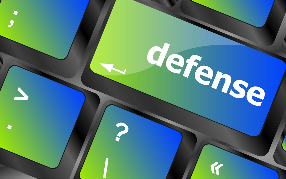 Computer keyboard keys with word defense - stock image