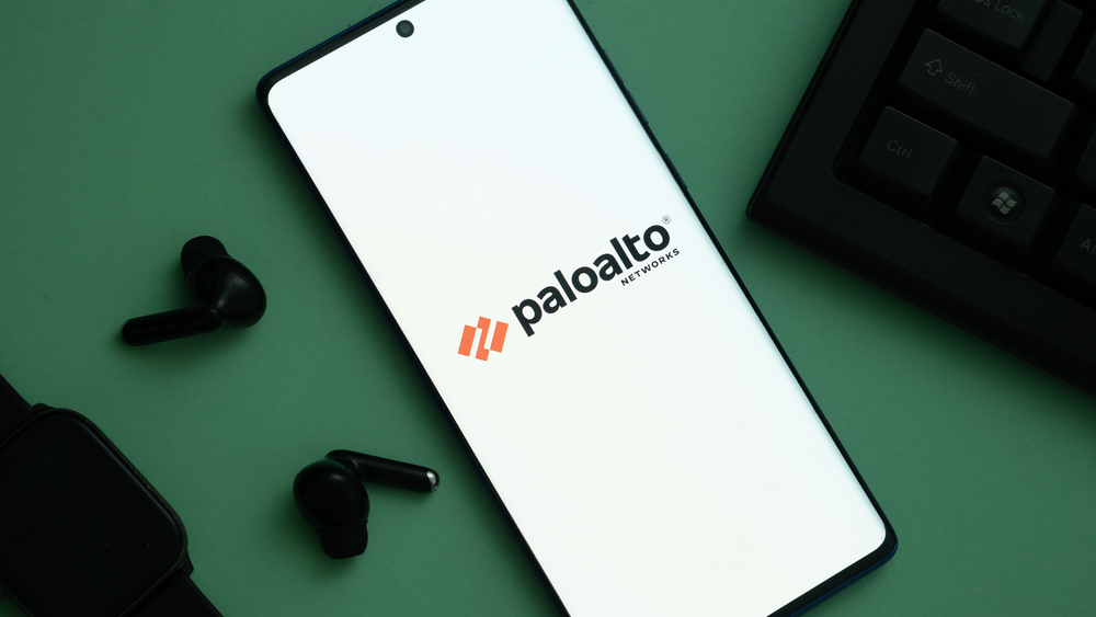 Dhaka, Bangladesh 04 May 2025: PaloAlto Networks logo of an American cybersecurity company is seen on a mobile phone and a computer screen. — Stock Editorial Photography
