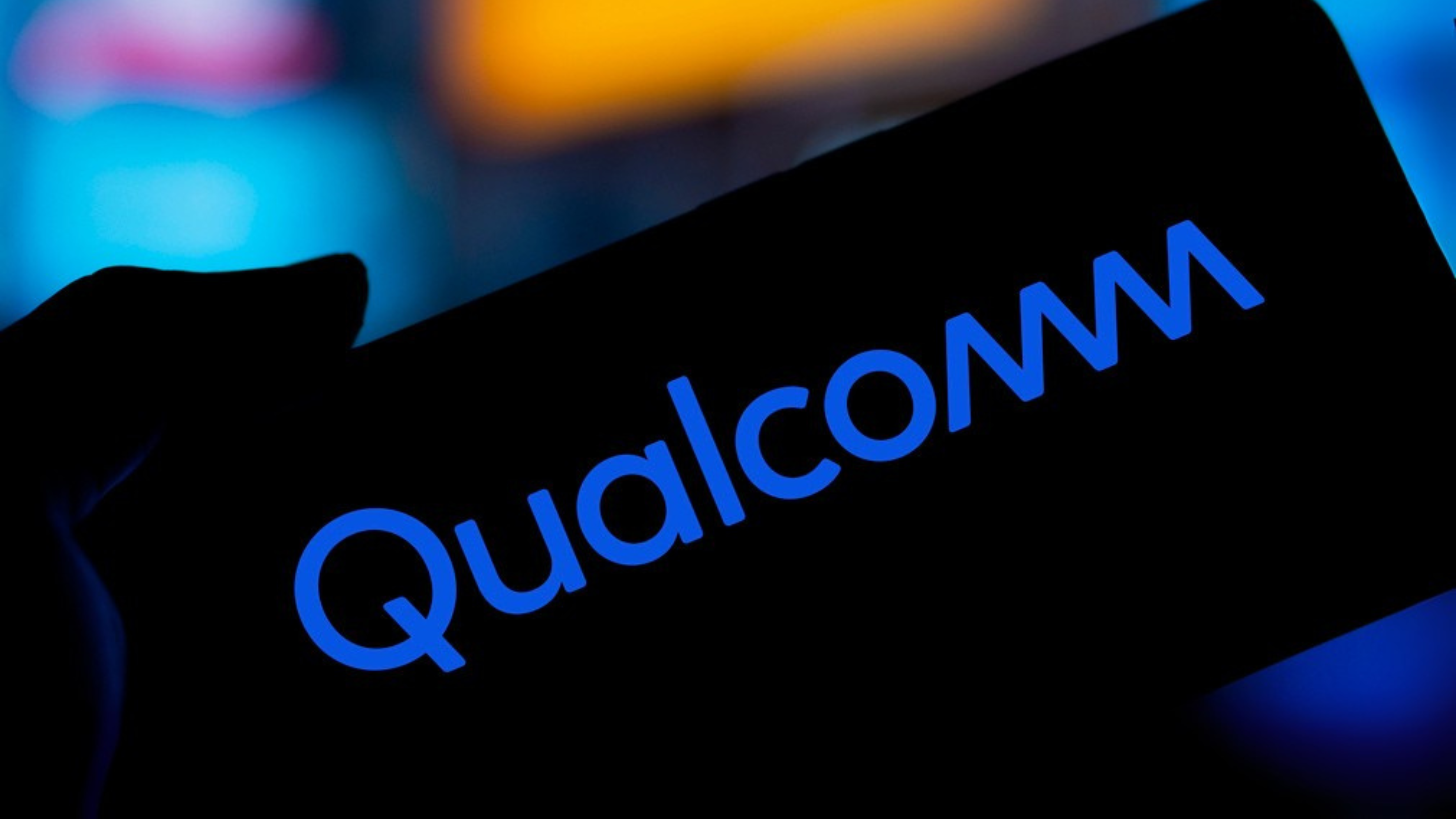 Qualcomm logo is displayed on smartphone