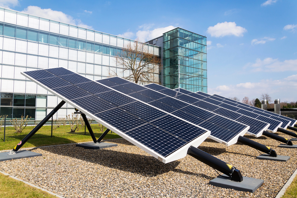 Blue rotating solar panels tilted axis tracker, future innovation energy concept