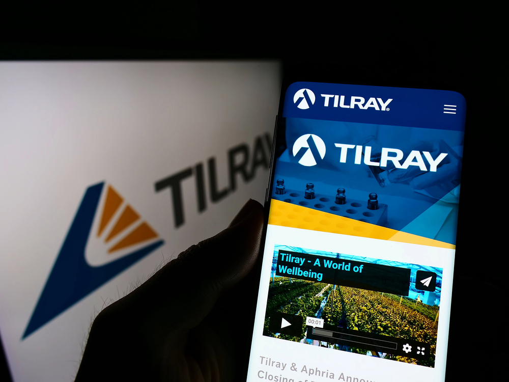 Logo visible on smartphone screen with website page