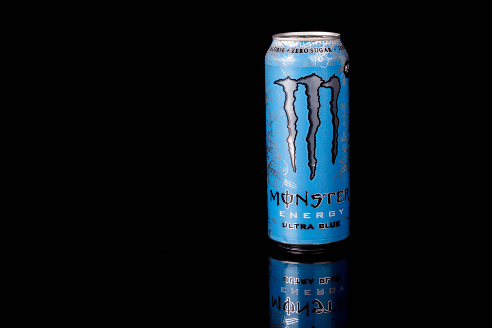 A can of Monster Ultra Blue Zero Sugar Energy Drink Isolated on a black background
