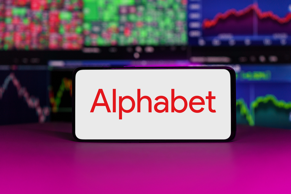 Alphabet logo on mobile phone screen company shares rise or fall on stock exchange market. London, United Kingdom - 2024 November 6