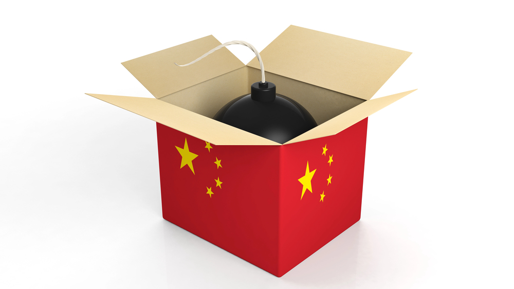 Bomb in box with flag of China, isolated on white background. — Photo