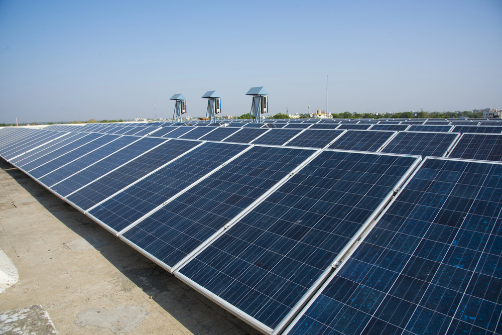 Photovoltaic solar panels on building roof, Regenerative energy system electricity generation, Maharashtra, India.
